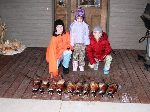 McKenzie, Lindsey and Karlee Jo with some roosters.